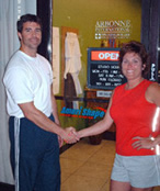 Health club owner shaking hands with an Amerishape Sales Promotion Representative